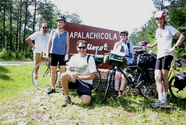 Five riders in front of Apalachicola NF sign